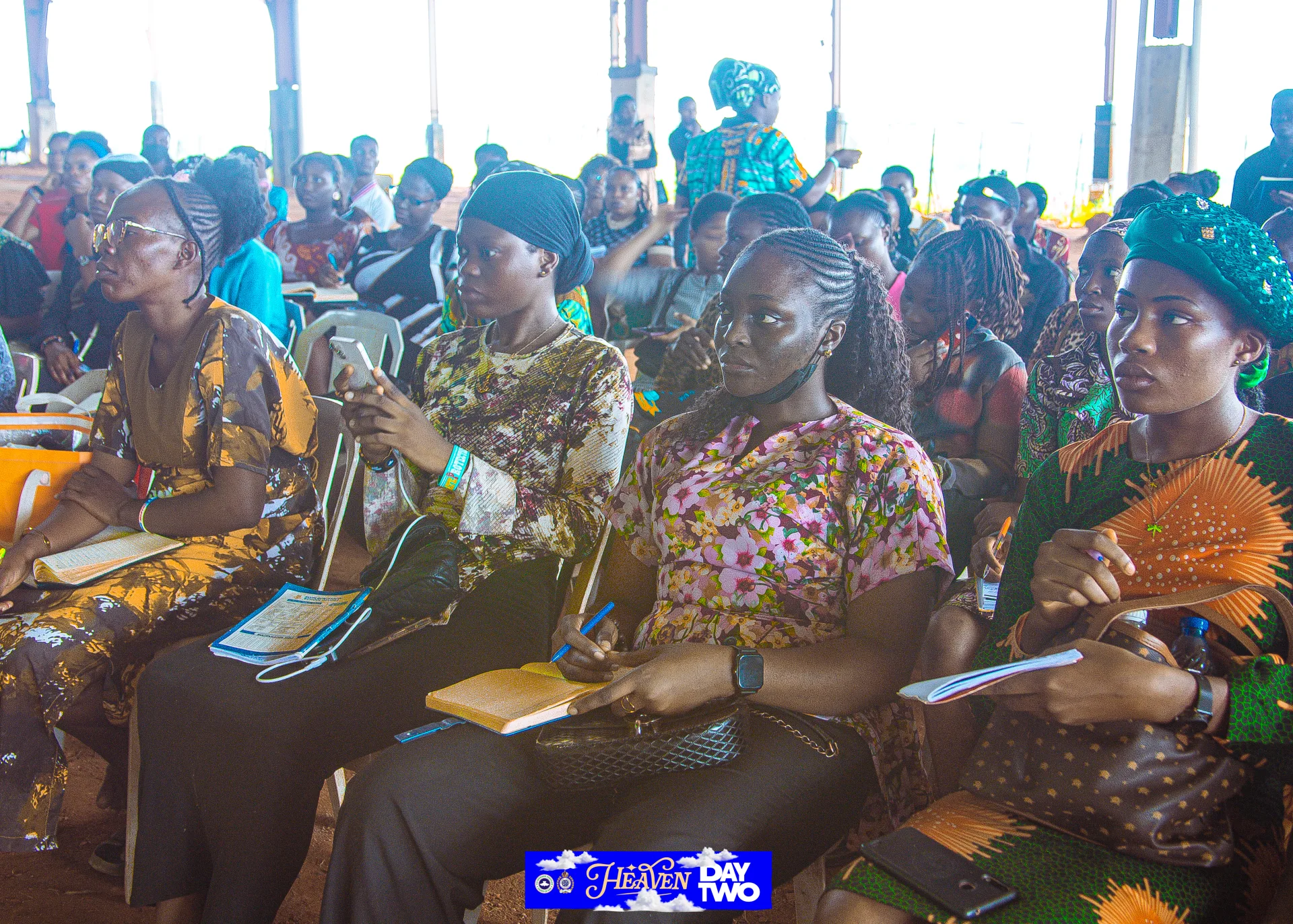 Participants practising fabric beading