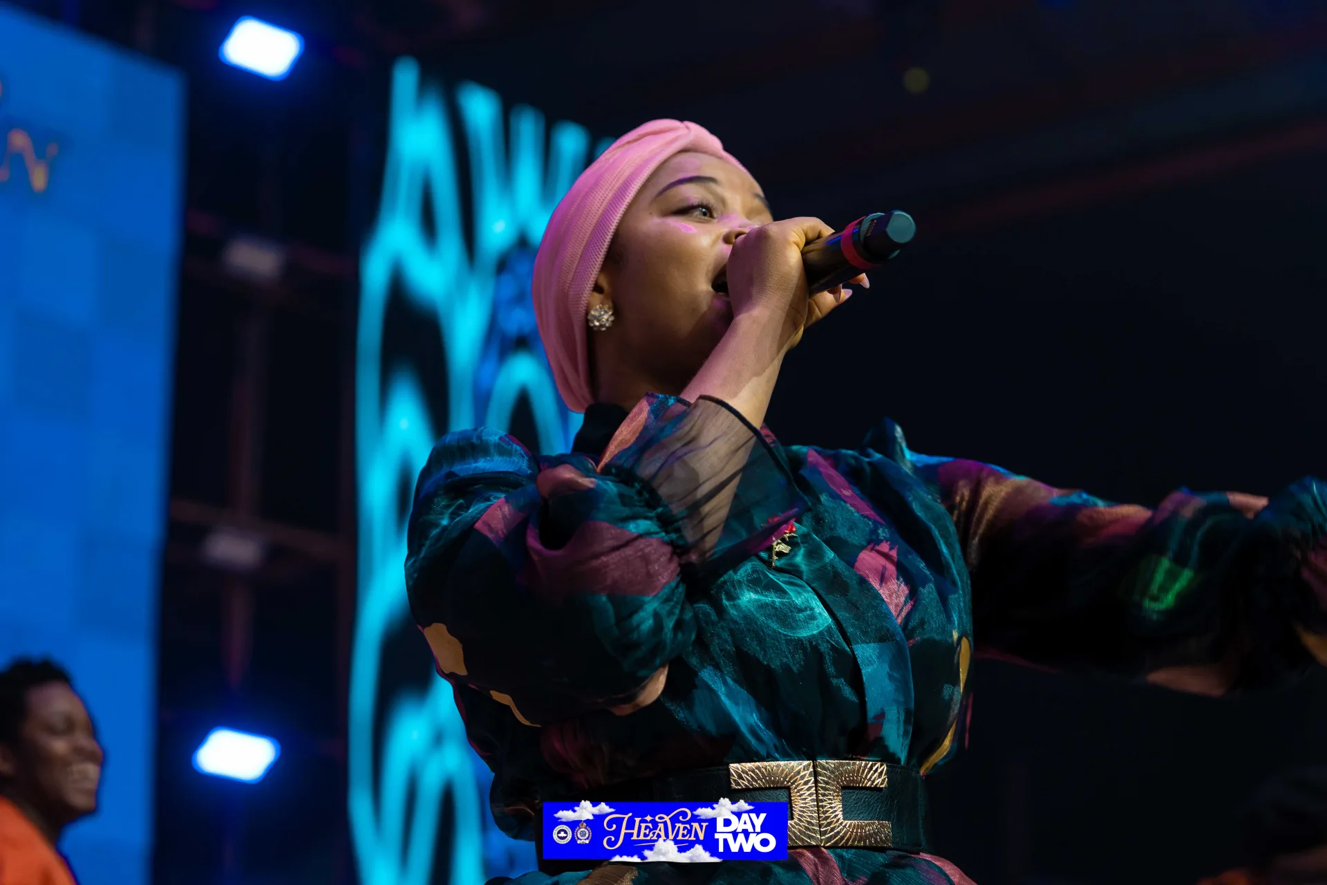 Blessing Lopez singing beneath the Heaven stage design