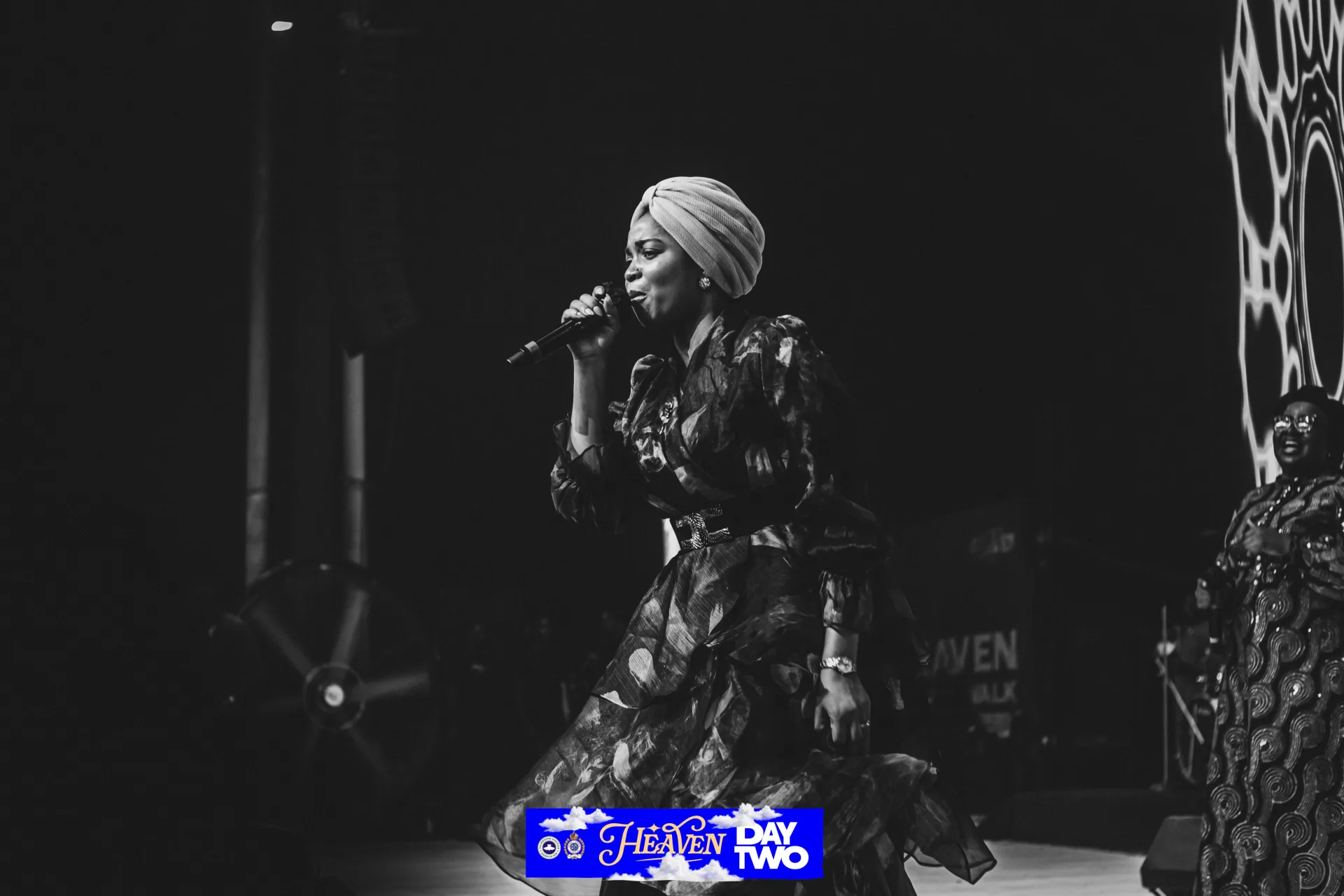 Blessing Lopez in a black-and-white stage portrait